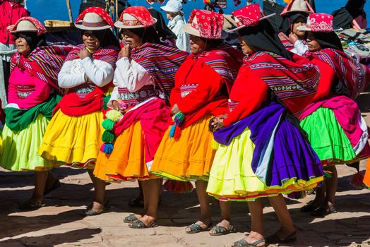 Puno, Peru - July 25, 2013: musicians and dancers in the peruvian Andes at Taquile Island on Puno Peru at july 25th, 2013.