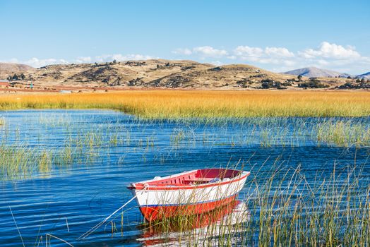 boat in Titicaca Lake in the peruvian Andes at Puno Peru