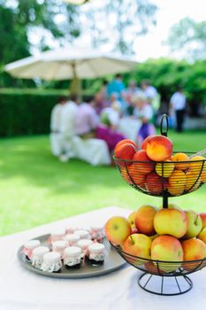 Garden Party, in the foreground a fruit bowl