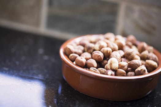 Bowl of hazelnuts with shallow depth of field