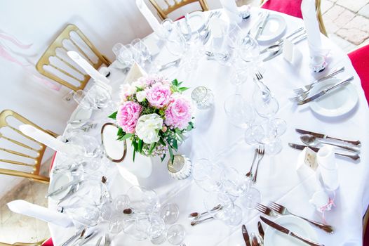 Round Table decorated with Flowers on a wedding ceremony