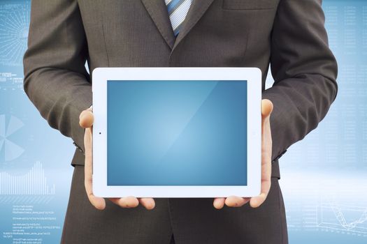 Businessman in a suit holding a tablet computer. Tablet screen is empty