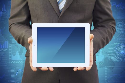 Businessman in a suit holding a tablet computer. Tablet screen is empty