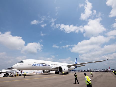 SINGAPORE - FEBRUARY 12: Airbus A350 XWB prototype 003 being towed at Singapore Airshow, Changi Exhibition Centre in Singapore on February 12, 2014.