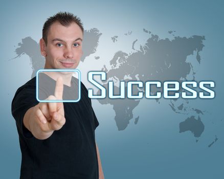 Young man press digital Success button on interface in front of him