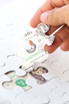 hand holding a puzzle piece, Finance concept