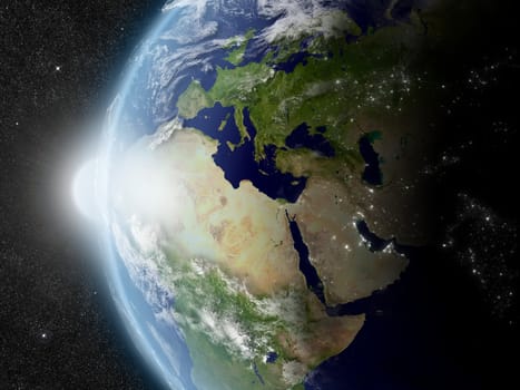 Sunset over Europe, Middle East and Africa region on planet Earth viewed from space with Sun and stars in the background. Elements of this image furnished by NASA.