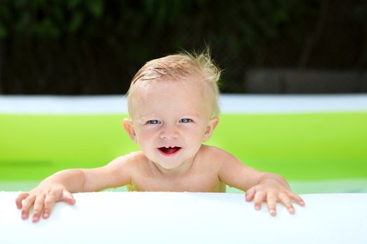 Happy Baby Boy Portrait in the Pool at Sunny Summer Day