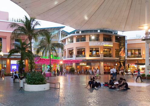 PHUKET, THAILAND - APRIL 26: Jungceylon shopping mall in Patong beach on APRIL 26, 2012 in Phuket, Thailand. Thai youth rests on the area under a tent Jungceylon shopping mall 