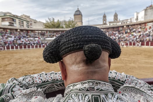 Ubeda, Jaen province, SPAIN - 2 october 2010: Detail of Bullfighter bald and slightly fat looking the bull during a bullfight held in Ubeda, Jaen province, Spain