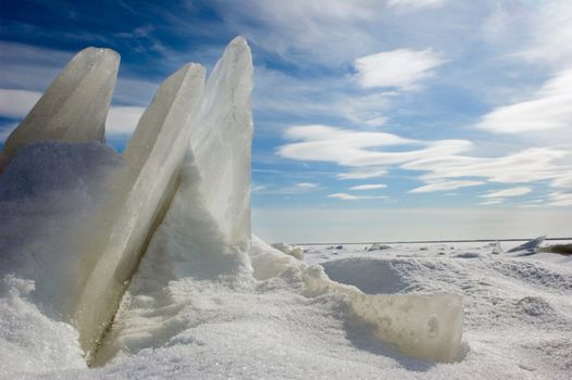 Chipped ice sharp peaks sticks out upwards. Clear frosty day. Russia. Winter.Ladoga Lake.