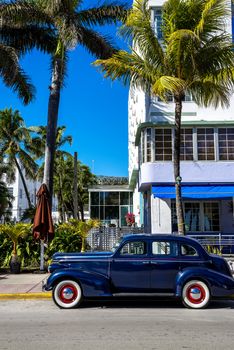 MIAMI BEACH - MARCH 20. Vintage Car Parked along Ocean Drive in the Famous Art Deco District in South Beach. South Beach, FL, March 20, 2011. 