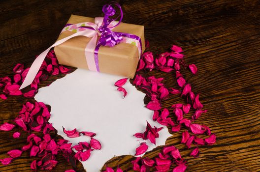 Blank sheet of paper in a still life with Valentine decoration