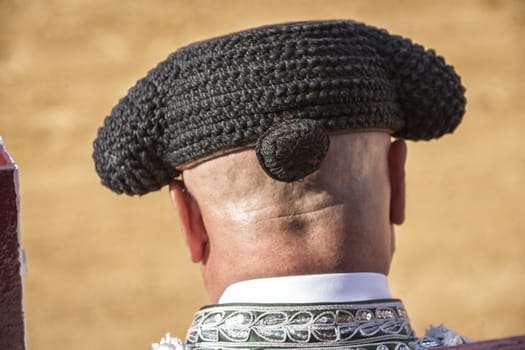 Ubeda, Jaen province, SPAIN - 2 october 2010: Detail of Bullfighter bald and slightly fat looking the bull during a bullfight held in Ubeda, Jaen province, Spain