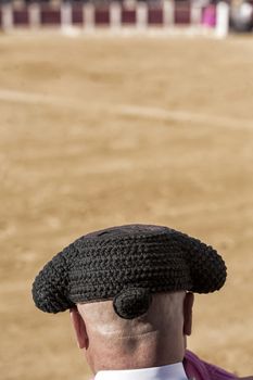 Ubeda, Jaen province, SPAIN - 2 october 2010: Detail of Bullfighter bald and slightly fat looking the bull during a bullfight held in Ubeda, Jaen province, Spain