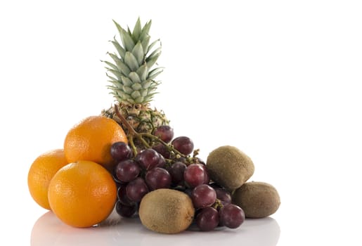 fruit as oranges pineapple grapes and kiwi isolated on white