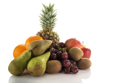 fruit as oranges pineapple grapes pear apple and kiwi isolated on white