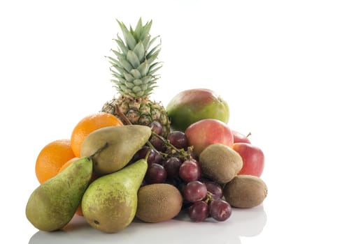 fruit as oranges pineapple grapes apple pear mango and kiwi isolated on white