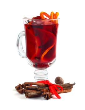 Hot red mulled wine with fruits and cinnamon isolated on white background