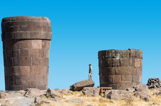 Tourist Silustani tombs in the peruvian Andes at Puno Peru