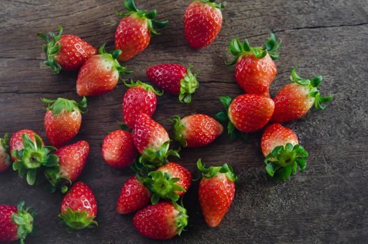 top view still life fresh strawberries  over  wooden background