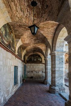 paintings in hallways inside Santa Catalina monastery in the peruvian Andes at Arequipa Peru