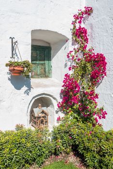 closed window and open birdcage in Santa Catalina monastery in the peruvian Andes at Arequipa Peru