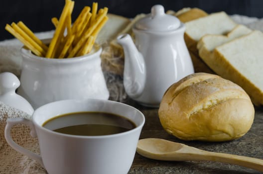 close up hot coffee with fresh bread on wooden table ,  still life