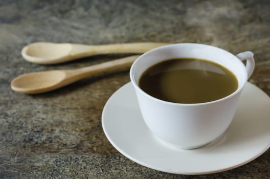 still life of coffee cup  with spoon  on a wooden table