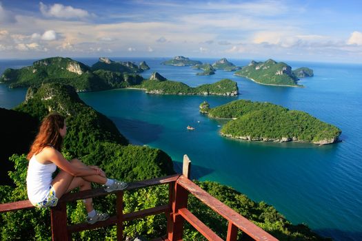 Young woman sitting at the view point, Wua Talab island, Ang Thong National Marine Park, Thailand