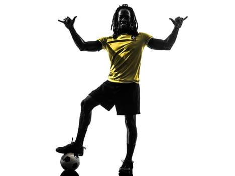 one black brazilian soccer football player man saluting in silhouette studio on white background