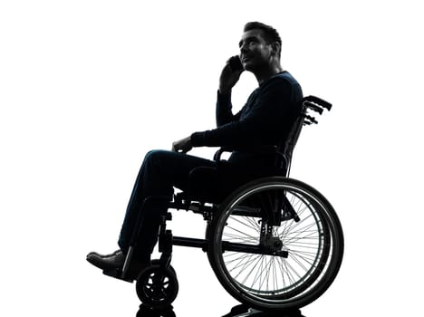 one handicapped man on the telephone in silhouette studio on white background