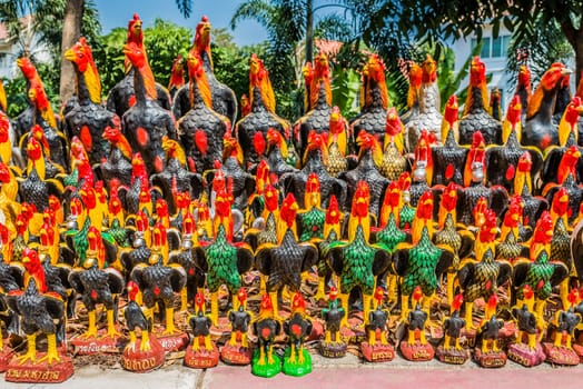 rooster statues offerings at Wat Yai Chaimongkol Ayutthaya bangkok thailand