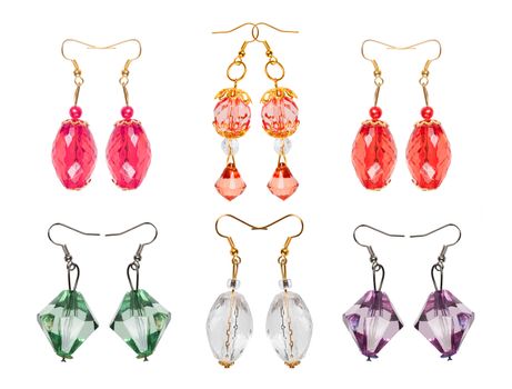 Earrings made and glass isolated on white background in different colors. Six pairs. Collage. 