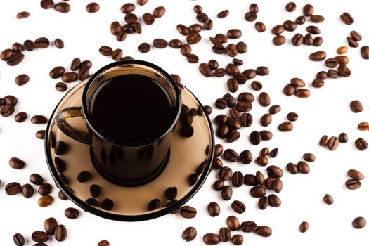 Coffee cup with coffee beans on white background.