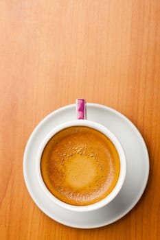 Cup of espresso coffe on table, shot from above