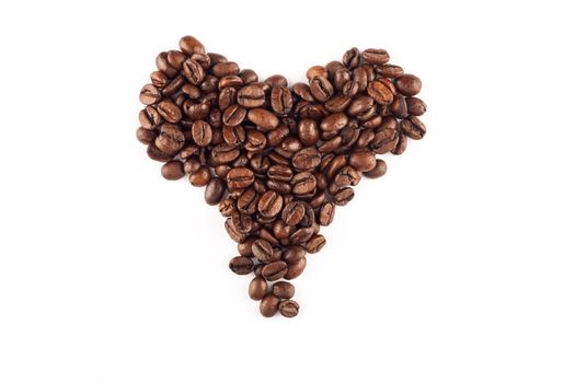 Coffee beans arranged in a heart shape.