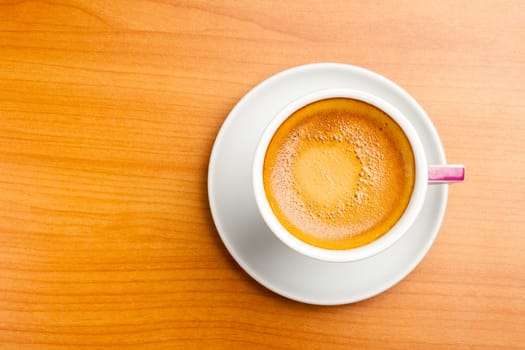 Cup of espresso coffe on table, shot from above