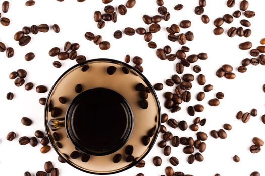 Coffee cup with coffee beans on white background.