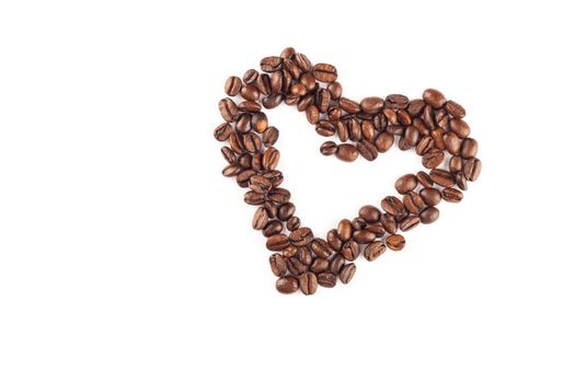 Coffee beans arranged in a heart shape.