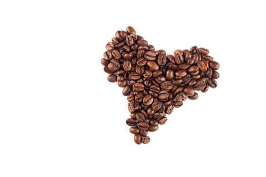 Coffee beans arranged in a heart shape.