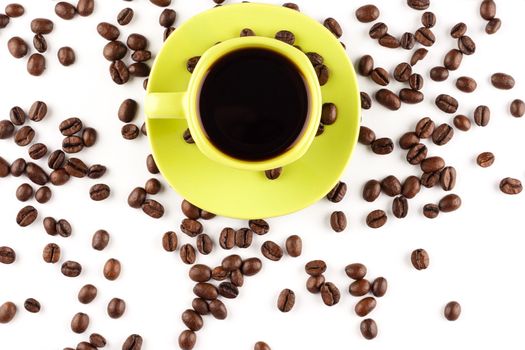 Coffee cup with coffee beans on white background.