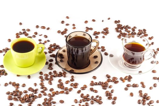 three coffee cups of different style on white background with coffee beans