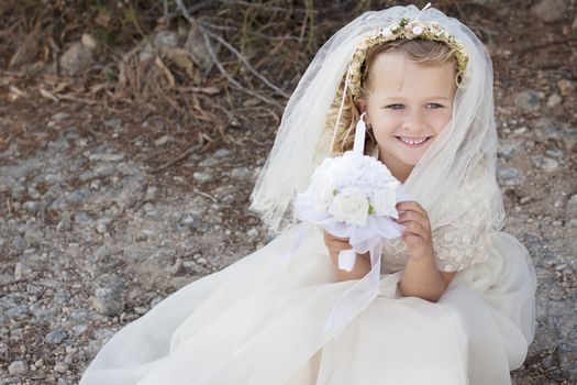 A young child doing her catholic first holy communion