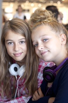 Two beautiful confident girls chilling out together