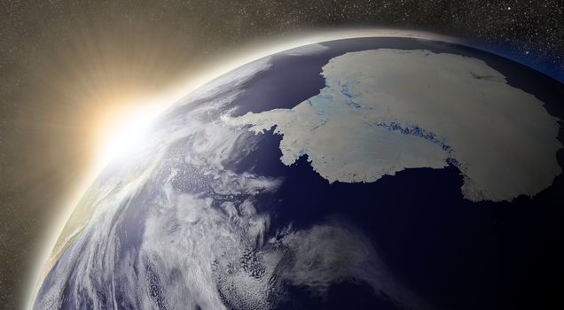 Sunset over Antarctica region on planet Earth viewed from space with Moon and stars in the background. Elements of this image furnished by NASA.