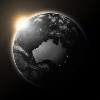 Sun over Australia on dark planet Earth isolated on black background. Highly detailed planet surface. Elements of this image furnished by NASA.