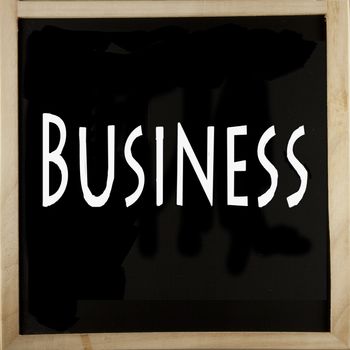 Word Business over a blackboard with wooden frame