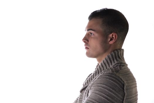 Profile of attractive young man with grey jersey, jumper or sweater, isolated on white