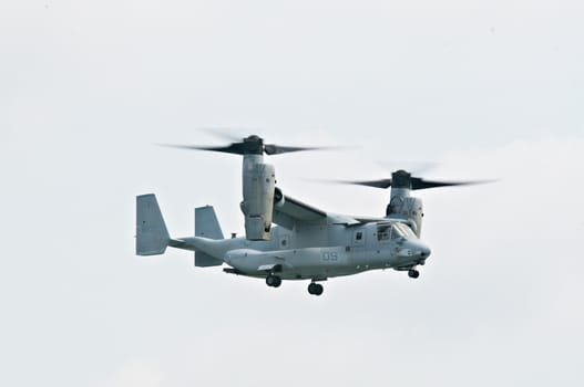 SINGAPORE - FEBRUARY 12: Bell Boeing V-22 Osprey hovering at Singapore Airshow, Changi Exhibition Centre in Singapore on February 12, 2014.